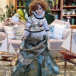 Elegant Porcelain Doll with Green Satin Dress